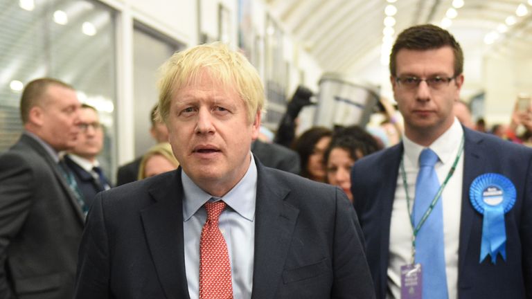 Britain's Prime Minister and Conservative leader Boris Johnson arrives at the count centre in Uxbridge, west London, on December 13, 2019 as votes were counted as part of the UK general election. - Prime Minister Boris Johnson's ruling party appeared on course for a sweeping victory in Thursday's snap election, an exit poll showed, paving the way for Britain to leave the EU next month after years of political deadlock. (Photo by Oli SCARFF / AFP) (Photo by OLI SCARFF/AFP via Getty Images)
