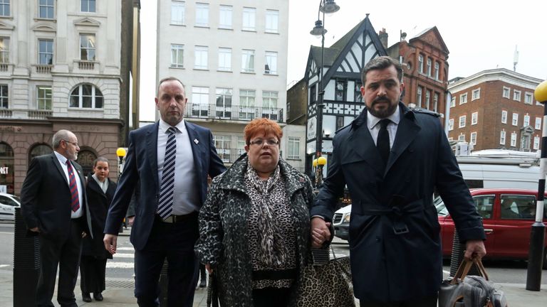 Sarah-Jane Young (centre), the daughter of Lance Corporal Young, a victim of the Hyde Park bombing, with lawyer, Matt Jury (right), and Mark Tipper (left), the brother of Trooper Simon Tipper, another victim of the attack, arrives at the High Court in London to hear the ruling in the civil case brought by relatives of the Hyde Park bombing victims against convicted IRA member John Downey.