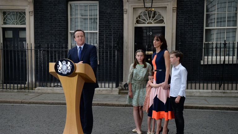 Outgoing British prime minister David Cameron speaks beside (L-R) his daughter Nancy Gwen, daughter Florence Rose Endellion, his wife Samantha Cameron and son Arthur Elwen outside 10 Downing Street in central London on July 13, 2016 before going to Buckingham Palace to tender his resignation to Queen Elizabeth II. 
Outgoing British prime minister David Cameron urged his successor Theresa May on Wednesday to maintain close ties with the EU even while negotiating to leave it, as he paid a fond farewell to MPs hours before leaving office. Cameron will tender his resignation on July 13 to Queen Elizabeth II at Buckingham Palace, after which the monarch will task the new leader of the Conservative Party Theresa May with forming a government.
 / AFP / OLI SCARFF        (Photo credit should read OLI SCARFF/AFP via Getty Images)