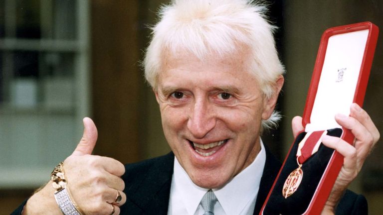 Sir James Savile, with his knighthood from the Queen. See SHOWBIZ Savile. Photo by Jim James.