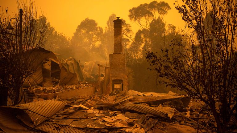 The remains of burnt out buildings are seen along main street in the New South Wales town of Cobargo on December 31, 2019, after bushfires ravaged the town. - Thousands of holidaymakers and locals were forced to flee to beaches in fire-ravaged southeast Australia on December 31, as blazes ripped through popular tourist areas leaving no escape by land. (Photo by SEAN DAVEY / AFP) (Photo by SEAN DAVEY/AFP via Getty Images)