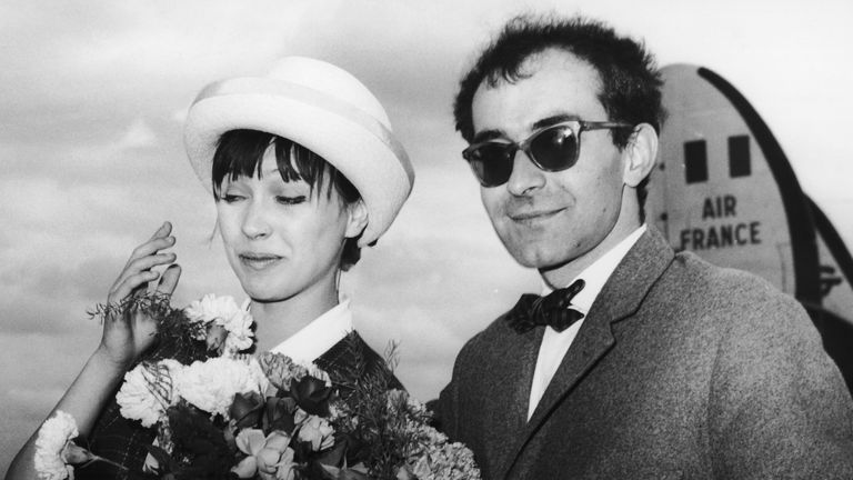 French film director Jean-Luc Godard arriving at Berlin airport with his wife, Danish actress Anna Karina, 28th June 1961. The couple are in town for the Berlin Film festival, where they will be promoting their film &#39;Une Femme Est Une Femme&#39;, written and directed by Godard, and starring Karina. (Photo by Keystone/Hulton Archive/Getty Images)