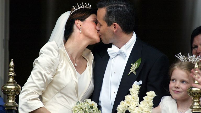 Ari Behn and Princess Louise share a kiss on their wedding day in 2002