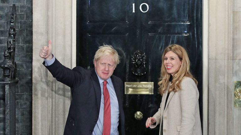 Boris Johnson and girlfriend Carrie Symonds arrive at 10 Downing Street after the Conservative victory