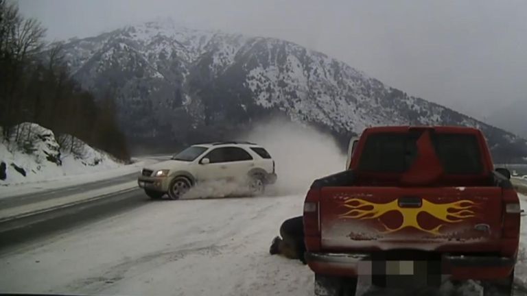 On Christmas Day, a local tow-truck driver had an extremely close call while helping a disabled vehicle in Alaska
