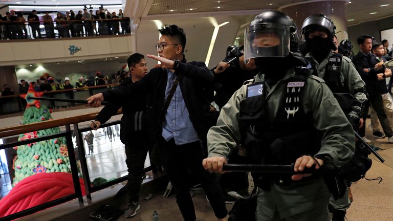 Riot police arrive to disperse anti-government demonstrators protesting inside a shopping mall on Christmas Eve in Hong Kong, China, December 24, 2019