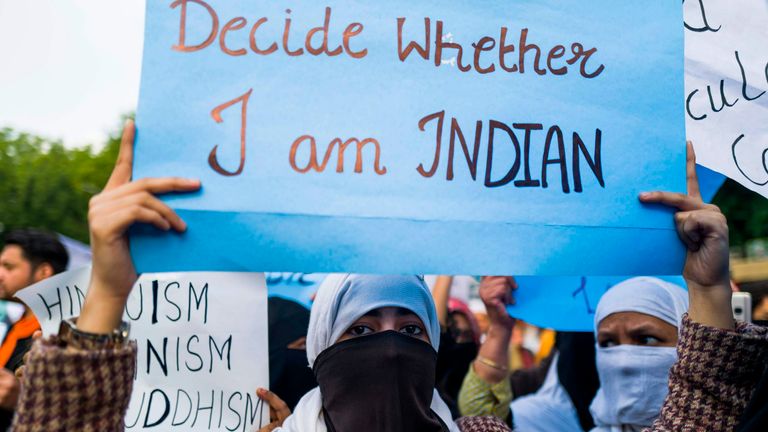 Protesters display placards during a demonstration against the Indian government&#39;s Citizenship Amendment Bill in New Delhi