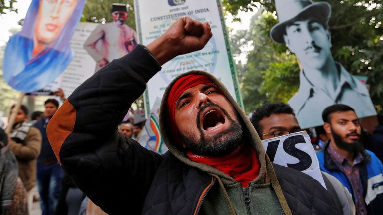 A demonstrator shouts slogans during a protest against a new citizenship law, in New Delhi