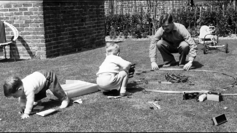 Eddie Izzard with his father and brother building a model railway