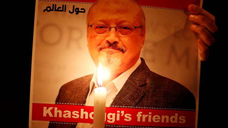 A demonstrator holds a poster with a picture of Saudi journalist Jamal Khashoggi outside the Saudi Arabia consulate in Istanbul, Turkey October 25, 2018.