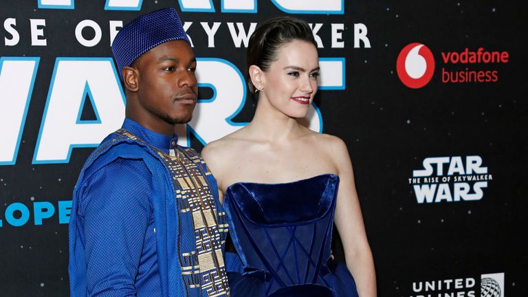 John Boyega and Daisy Ridley pose for pictures