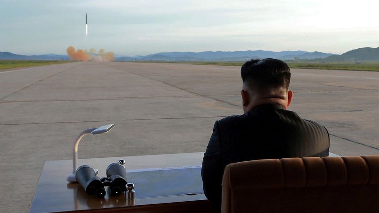 Kim Jong Un watches the launch of a Hwasong-12 missile 