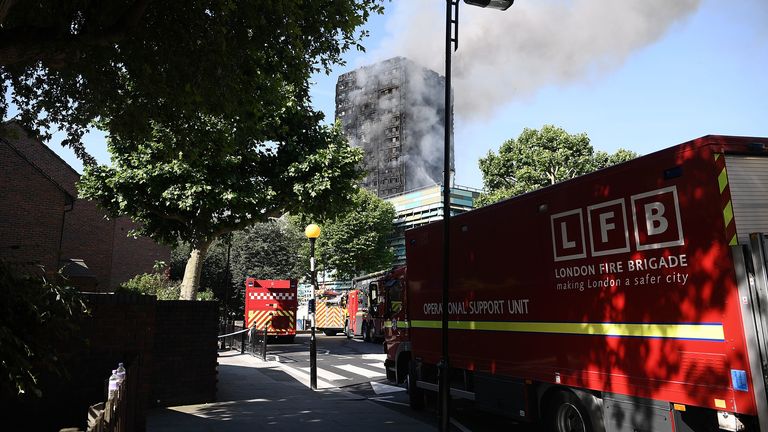 Fire brigade vehicles are parked near Grenfell Tower in the hours after the blaze in June 2017