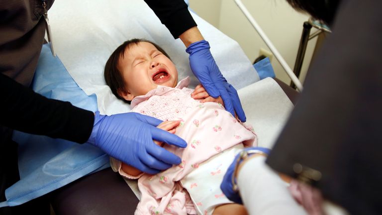 A one-year-old child is given a vaccine in Seattle, US