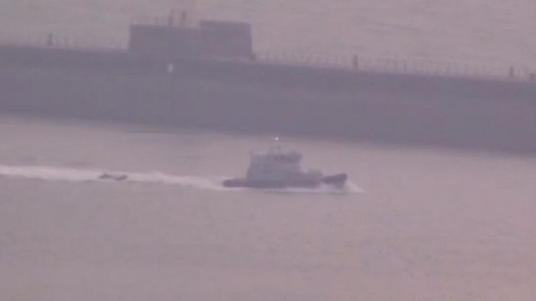 Suspected migrants are brought ashore at Dover in the early hours of Saturday