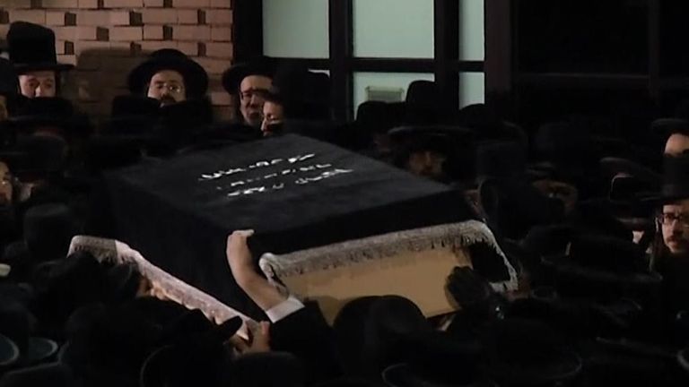 Members of New York&#39;s ultra-orthodox Jewish community gathered for funerals for two victims of Tuesday&#39;s shooting at a grocery in Jersey City, New Jersey.