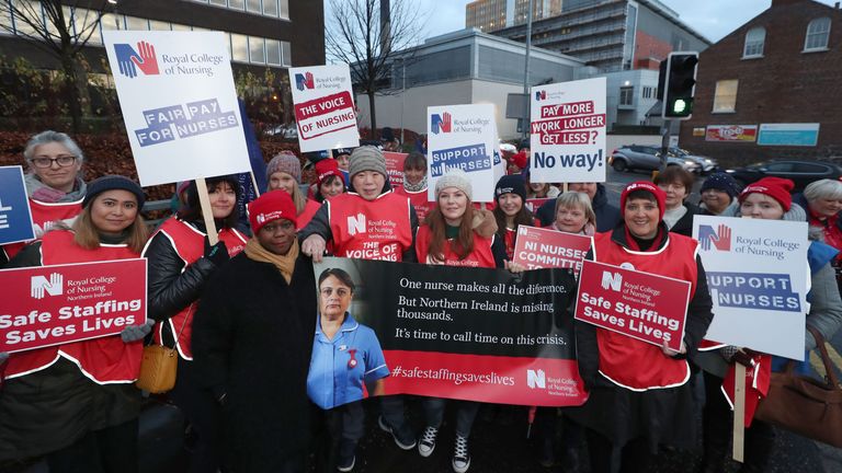 Royal College of Nursing Chief Executive and General Secretary Dame Donna Kinnair (fourth left) joins the picket line outside the Belfast City Hospital 