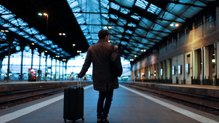 A traveler waits for a train at Gare de Lyon train station in Paris 
