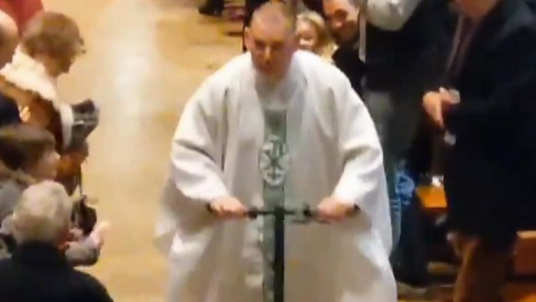 Father Peter O&#39;Connor departs mass on a scooter
