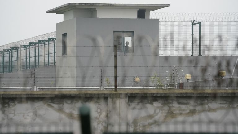A man is seen in a building of Qingpu Prison