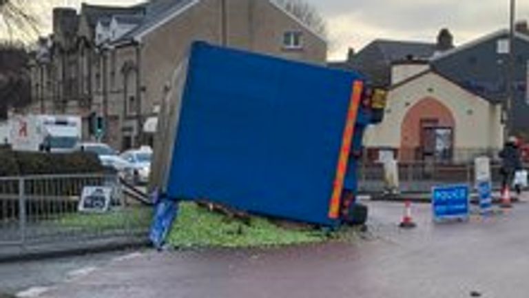 The trailer overturned and shed its load