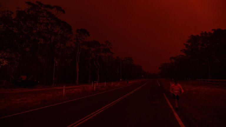  Residents watch the developing conditions near the town of Sussex Inlet on December 31, 2019 in Sydney, Australia