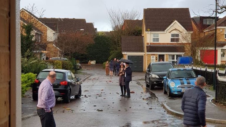 Residents assess the damage to their properties in Chertsey. Pic: @QPRSteve1982
