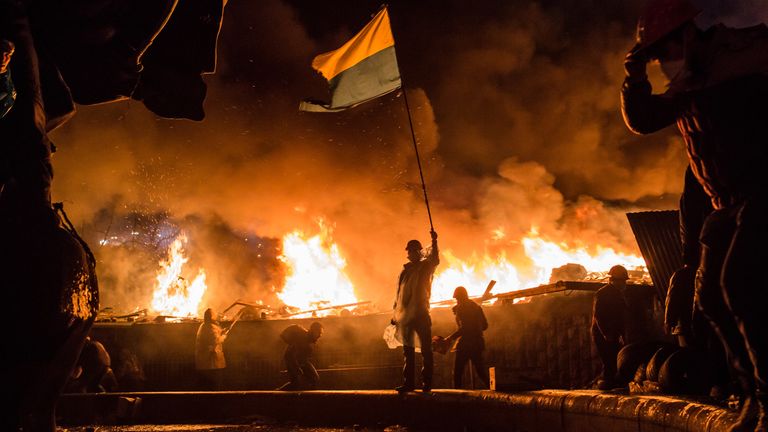 Anti-government protesters guard the perimeter of Independence Square, known as Maidan