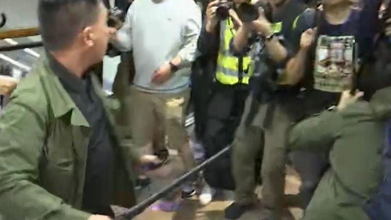 Violence erupts in Hong Kong shopping centre as protesters attack other people and police 