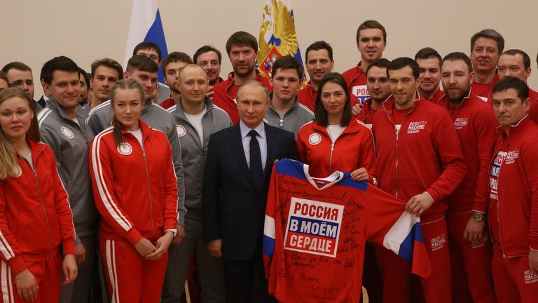 Russian president Vladimir Putin, centre, with 2018 Winter Olympics athletes