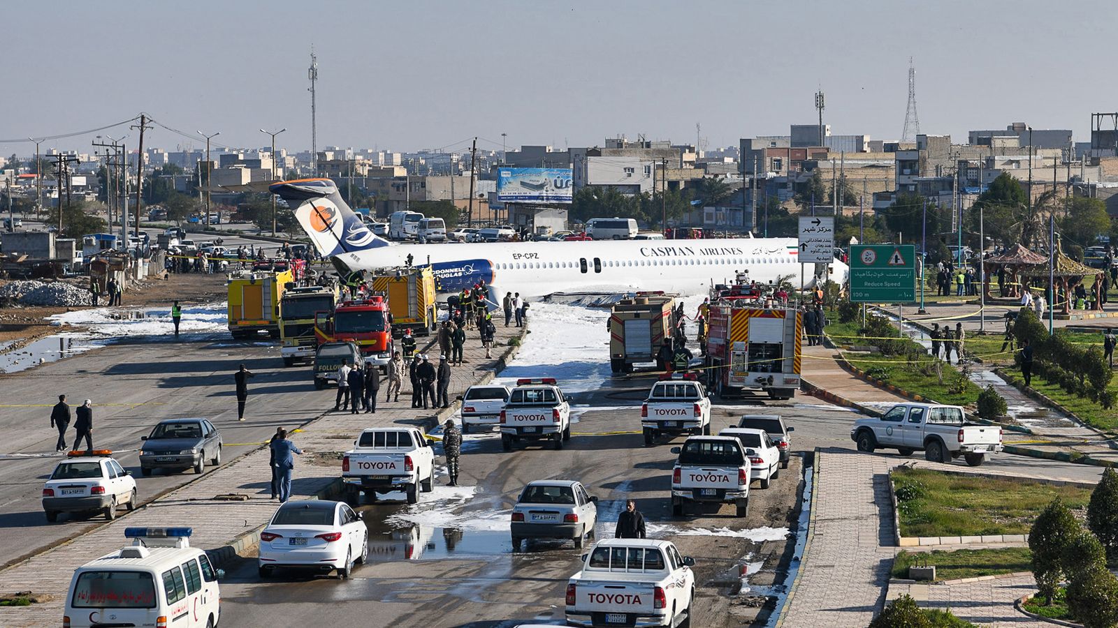 Passenger plane skids off runway onto nearby street in Iran