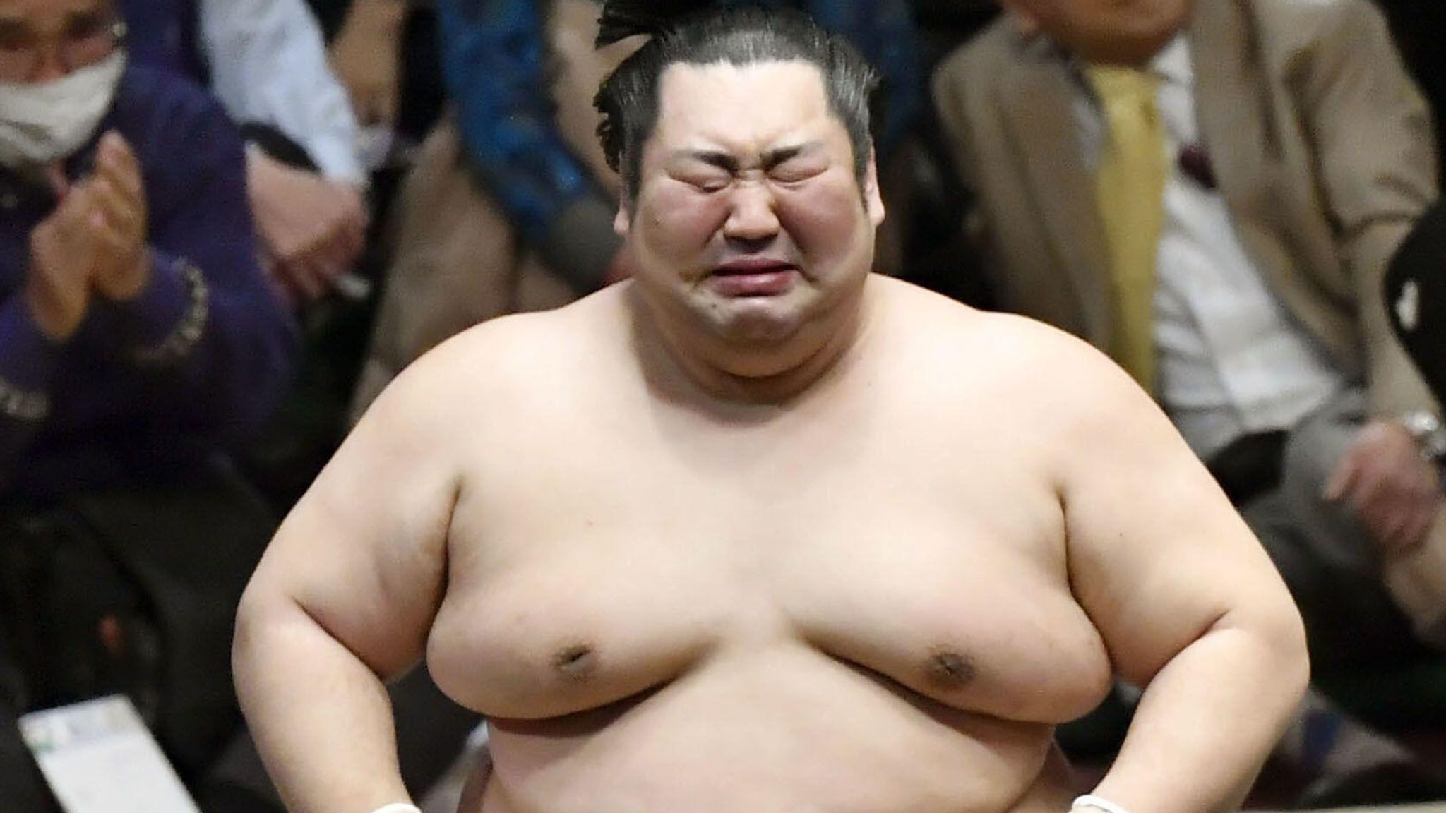 Japan Lowestranked sumo wrestler weeps as he defies odds to win