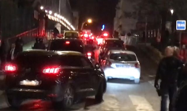 Emmanuel Macron rushed out of Paris theatre after protesters try to confront him