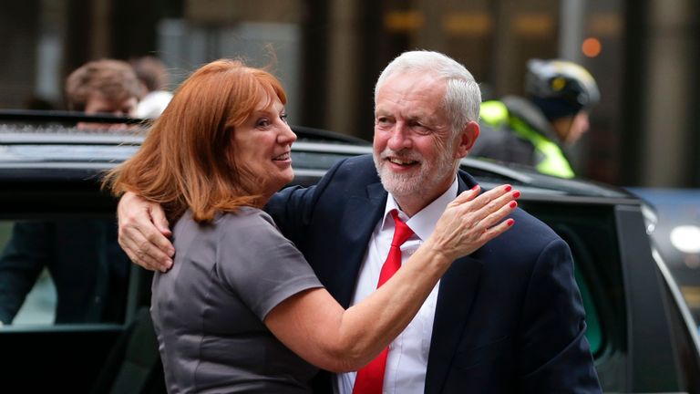 Britain's opposition Labour party Leader Jeremy Corbyn (R) embraces a member of his team Karie Murphy (L) as he arrives at Labour Party headquarters in central London on June 9, 2017 after results in a snap general election showing a hung parliament with Labour gains and the Conservatives losing its majority. British Prime Minister Theresa May faced pressure to resign on Friday after losing her parliamentary majority, plunging the country into uncertainty as Brexit talks loom. The pound fell sharply amid fears the Conservative leader will be unable to form a government and could even be forced out of office after a troubled campaign overshadowed by two terror attacks. / AFP PHOTO / Daniel LEAL-OLIVAS        (Photo credit should read DANIEL LEAL-OLIVAS/AFP via Getty Images)