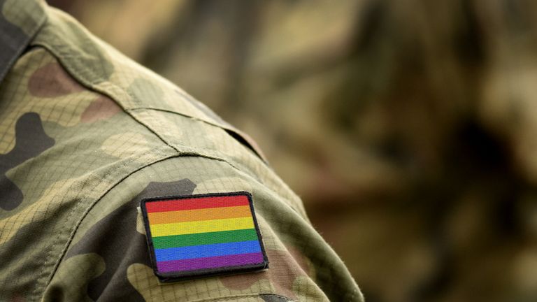 Rainbow flag (LGBT movement) on military uniform. Integration of homosexuals in the military. Discrimination in army. Collage.