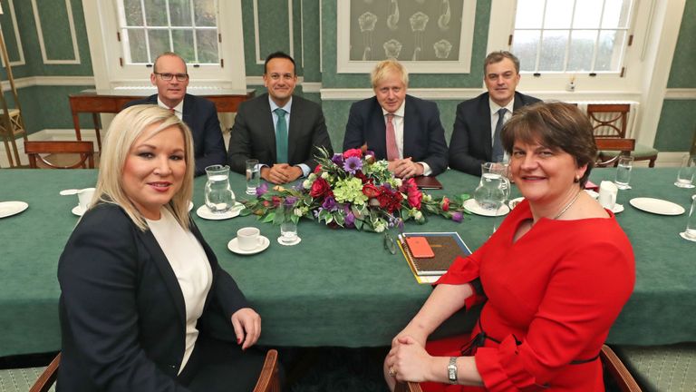 (Back L-R) Ireland's Foreign Minister Simon Coveney, Ireland's Prime Minister Leo Varadkar, Britain's Prime Minister Boris Johnson and Britain's Northern Ireland Secretary Julian Smith meet with (front R-L) Northern Ireland's First Minister Arlene Foster and Deputy First Minister Michelle O'Neill at the Parliament Buildings, the seat of the of the Northern Ireland Assembly, on the Stormont Estate in Belfast on January 13, 2020. - British Prime Minister Boris Johnson hailed "an historic time" for Northern Ireland ahead of a visit to the province on Monday to mark the reopening of its power-sharing government after three years of deadlock. (Photo by Liam McBurney / POOL / AFP) (Photo by LIAM MCBURNEY/POOL/AFP via Getty Images)