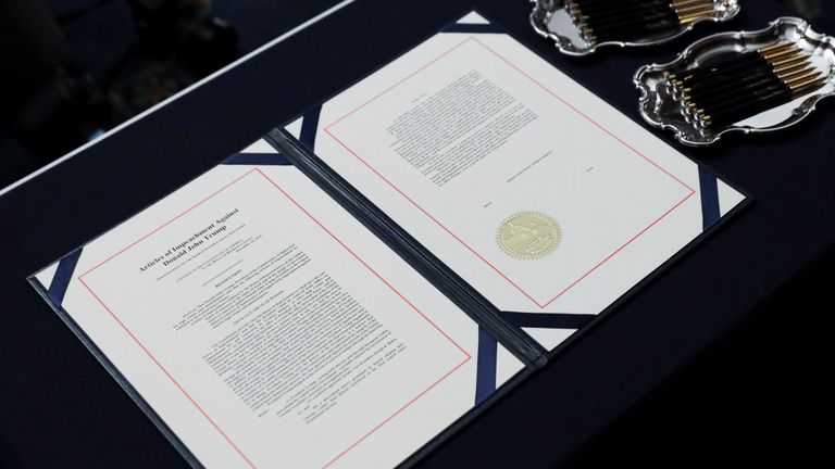 The two U.S House of Representatives articles of impeachment of President Donald Trump await the signature of House Speaker Nancy Pelosi (D-CA) before an engrossment ceremony at the U.S. Capitol in Washington, U.S., January 15, 2020. REUTERS/Leah Millis