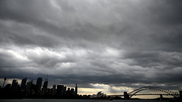 TOPSHOT - Storm clouds gather over Sydney Harbour on January 20, 2020. - Thunderstorms and giant hail battered parts of Australia&#39;s east coast after "apocalyptic" dust storms swept across drought-stricken areas, as extreme weather patterns collided in the bushfire-fatigued country. (Photo by PETER PARKS / AFP) (Photo by PETER PARKS/AFP via Getty Images)
