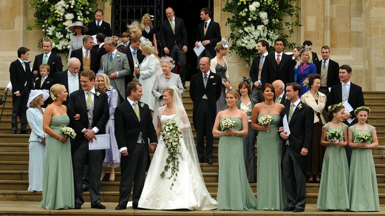 WINDSOR - MAY 17: Bride and groom, Autumn Kelly and Peter Phillips poses for photos with friends and family wedding guests after their wedding ceremony at St. George's Chapel on May 17, 2008 in Windsor, England.    (Photo by Anwar Hussein/WireImage)