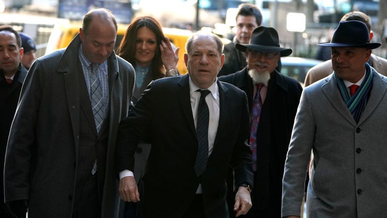 Harvey Weinstein(C) arrives at the Manhattan Criminal Court, on January 22, 2020 for opening arguments in his rape and sexual assault trial in New York City. - Opening arguments in Harvey Weinstein's rape and sexual assault trial are due Wednesday, with the defense expected to detail "loving" emails between the once-mighty movie producer and his accusers. Weinstein, 67, faces life in prison if convicted of predatory sexual assault charges related to two women in the high-profile New York proceedings seen as key to the #MeToo movement. (Photo by TIMOTHY A. CLARY / AFP) (Photo by TIMOTHY A. CLARY/AFP via Getty Images)