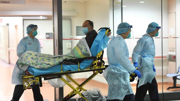 Medical staff transfer a patient of a suspected case of a new coronavirus at the Prince of Wales Hospital in Hong Kong, China January 22, 2020. Picture taken January 22, 2020. cnsphoto via REUTERS. ATTENTION EDITORS - THIS IMAGE WAS PROVIDED BY A THIRD PARTY. CHINA OUT.