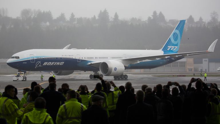 Boeing employees and guests welcome a Boeing 777X airplane returning from its inaugural flight at Boeing Field in Seattle, Washington on January 25, 2020. - Boeing's new long-haul 777X airliner made its first flight Saturday, a major step forward for the company whose broader prospects remain clouded by the 737 MAX crisis. The plane took off from a rain-slicked runway a few minutes after 10:00 am local time (1800 GMT), at Paine Field in Everett, Washington, home to Boeing's manufacturing site in the northwestern US. (Photo by Jason Redmond / AFP) (Photo by JASON REDMOND/AFP via Getty Images)