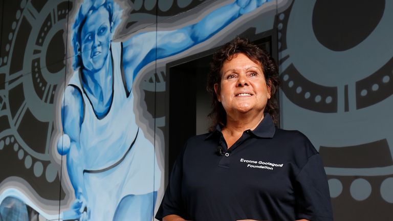 DARWIN, AUSTRALIA - AUGUST 29: Evonne Goolagong Cawley stands in front of a mural of her painted by a group of local artists, including David Collins and Indigenous artists Shaun Lee ‘Hafleg’ and Jesse Bell to celebrate and recognise her incredible achievements during the National Indigenous Tennis Carnival at the Darwin International Tennis Centre on August 29, 2019 in Darwin, Australia. (Photo by Darrian Traynor/Getty Images)