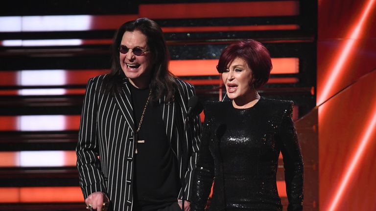 British singer Ozzy Osbourne (L) and wife British television personality Sharon Osbourne present the award for Best Rap/Sung Performance during the 62nd Annual Grammy Awards on January 26, 2020, in Los Angeles. (Photo by Robyn Beck / AFP) (Photo by ROBYN BECK/AFP via Getty Images)