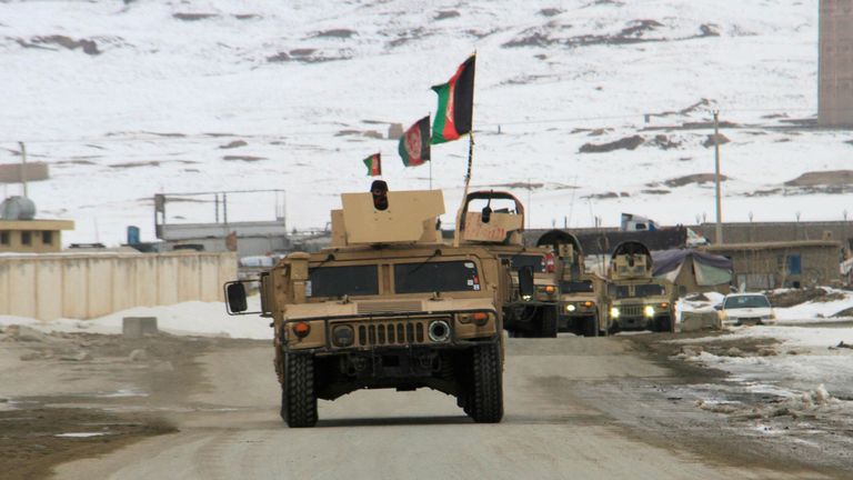 Afghan National Army forces travelling towards the site of an airplane crash in Deh Yak district of Ghazni province