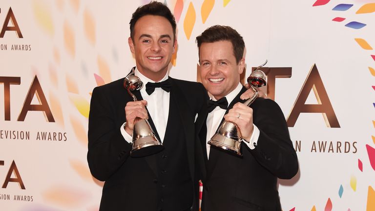 Ant and Dec hold up their awards after winning best presenter at the NTAs