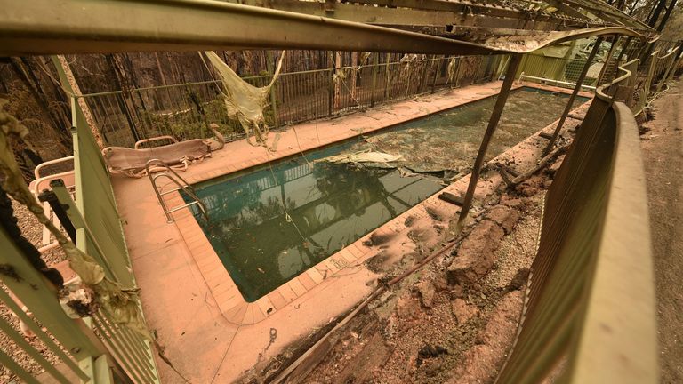 A swimming pool in the remains of a house destroyed by bushfires outside Batemans Bay in New South Wales