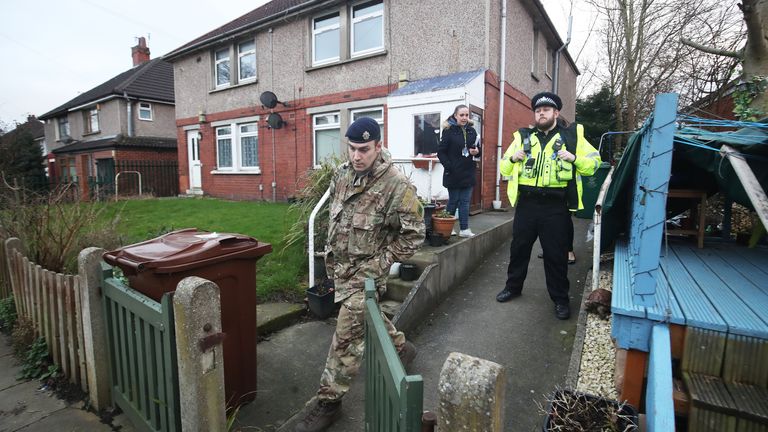 Police and bomb squads searched three homes in Bradford