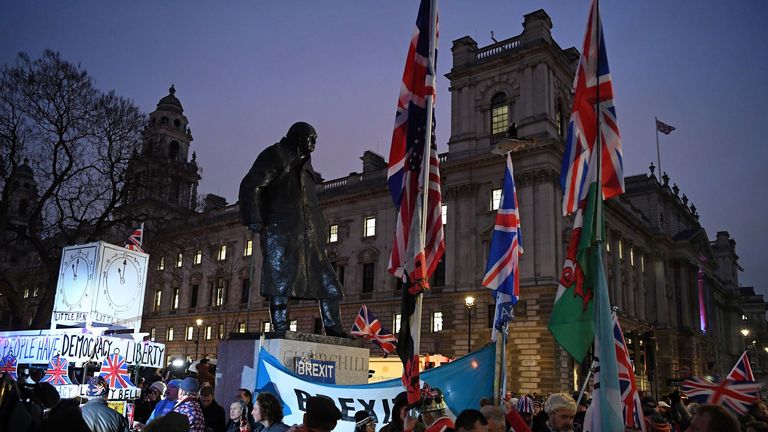 Brexit supporters carry flags and placards as they walk down Whitehall in central London on January 31, 2020 on the day that the UK formally leaves the European Union. - Britain on January 31 ends almost half a century of integration with its closest neighbours and leaves the European Union, starting a new -- but still uncertain -- chapter in its long history. (Photo by DANIEL LEAL-OLIVAS / AFP) (Photo by DANIEL LEAL-OLIVAS/AFP via Getty Images)