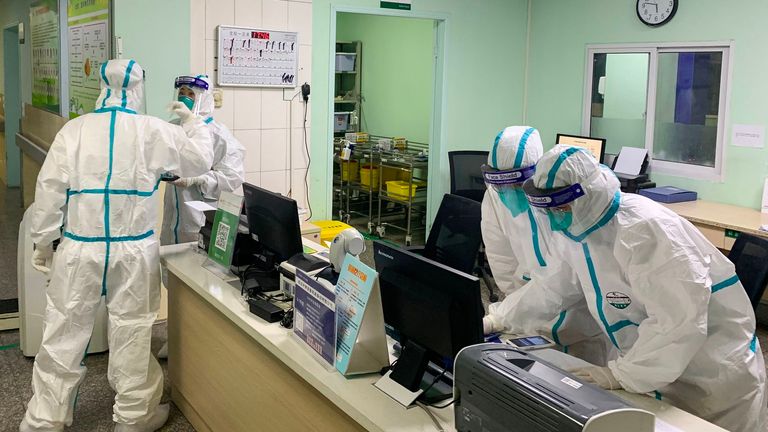 Medical staff wearing protective suits at the Zhongnan hospital in Wuhan in China&#39;s central Hubei province